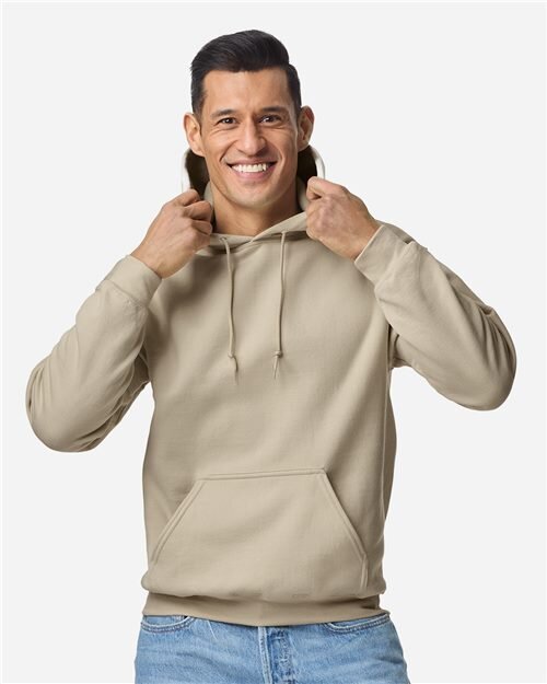 Sand-colored Gildan 18500 heavyweight hooded sweatshirt worn by a model